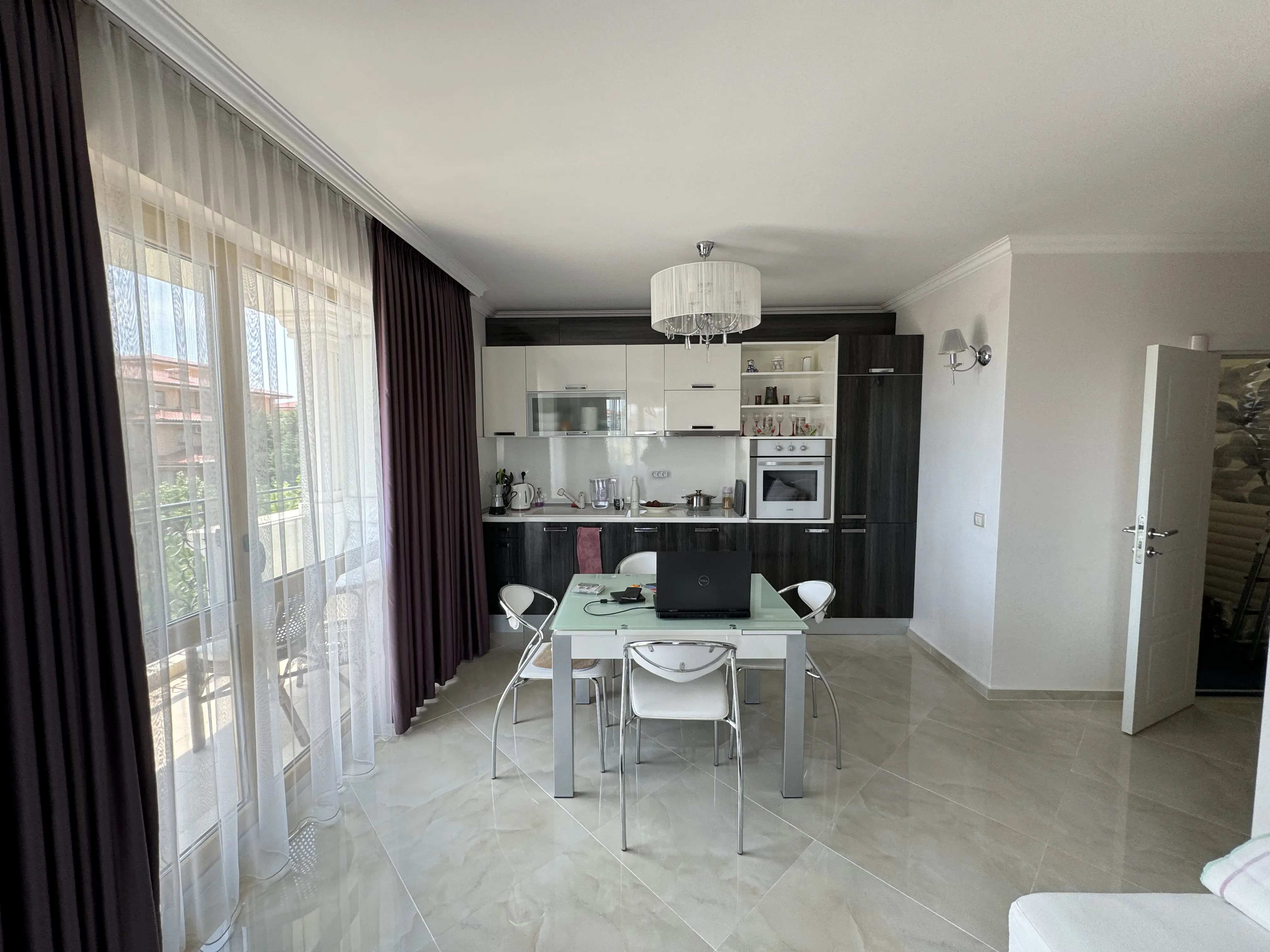 Living and dining area of the offered 105-m² apartment.